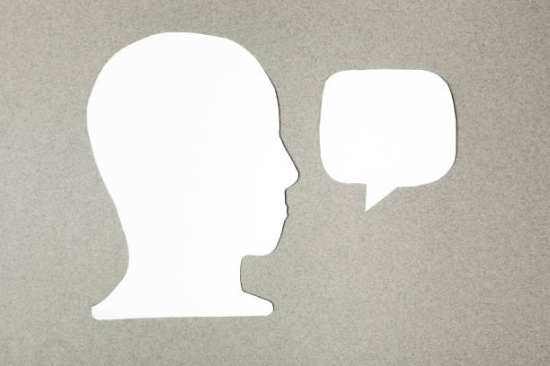 istock paper face and speech bubble on colorbackground copy space for text, communication, symbolic 1372186856