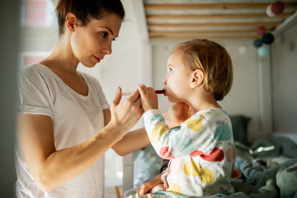 istock Mother taking care of sick child 1372187514