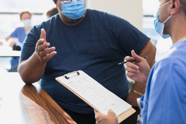 istock Patient talks to the doctor 1372188448
