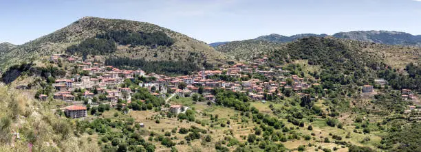 Photo of View of the village Dimitsana in the mountains on a sunny day (district Arcadia, Peloponnese, Greece).