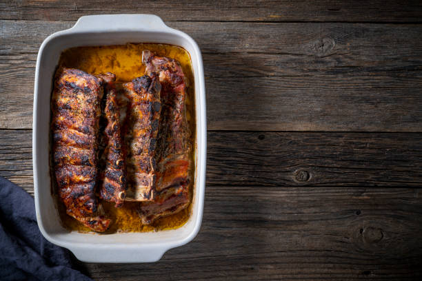 istock Roasted ribs in a tray with herbs and spices 1372188737