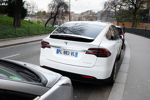 Paris, France - 13 February 2022: Rear view of a stationary Tesla Model X electric car in Paris, France