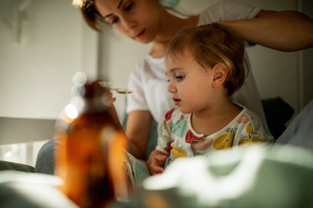 istock Mother taking care of sick child 1372189321