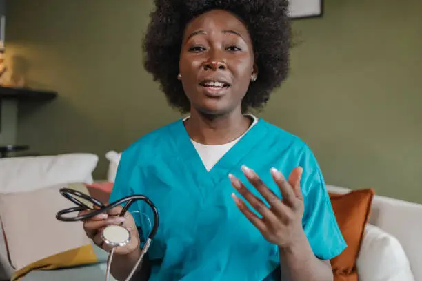 Photo of Portrait of a female doctor talking on a video call with patient