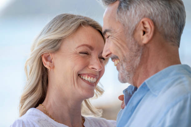 istock Mature couple dancing. They are smiling, laughing  and having fun 1372189867