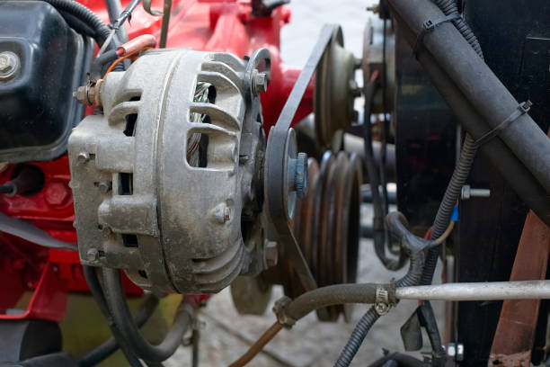 Automotive alternator with a belt on a pulley.