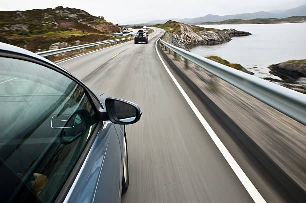 car driving fast on the coast