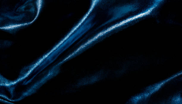 istock background of undulating blue fabric with shadows 1372192420