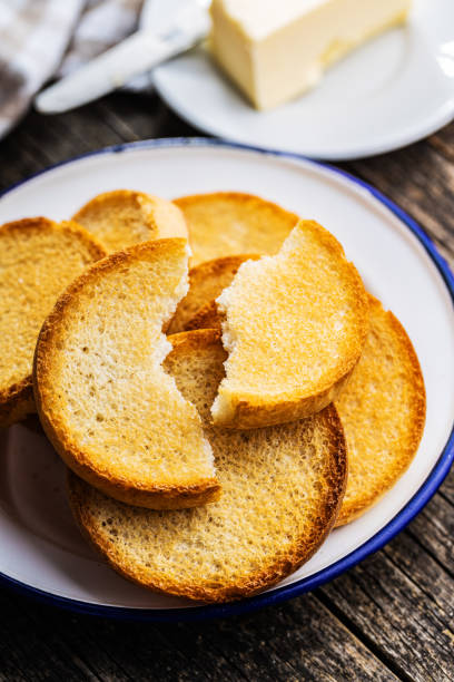 Dietary rusks bread. Crusty biscuits. Dietary rusks bread. Crusty biscuits on wooden table. zwieback toast stock pictures, royalty-free photos & images
