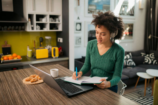 istock Happy African American female freelancer working from home 1372194671
