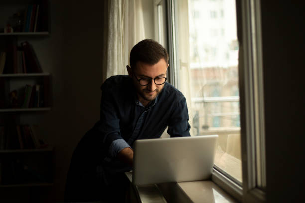 istock Young Caucasian man work on laptop 1372196537