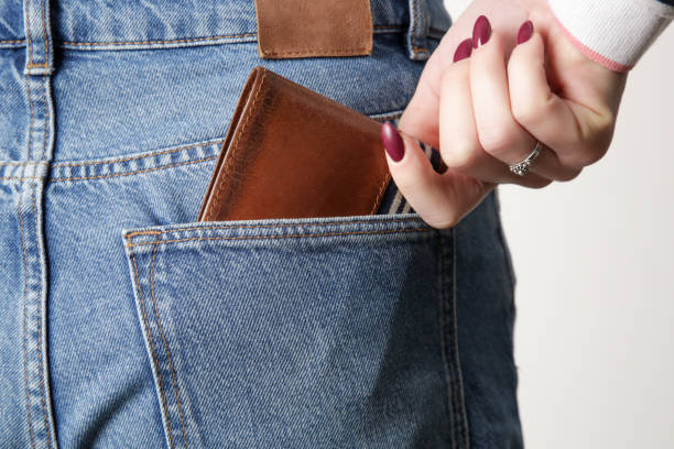 istock Brown leather wallet in jeans pocket 1372199865