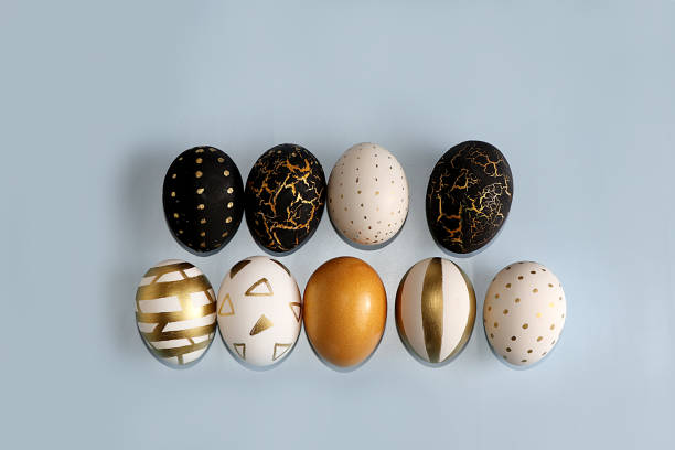 istock Happy Easter concept, spring card, background. Decorated golden Easter eggs on a gray background. Minimal holiday concept, place for text, banner for screen, 1372200106