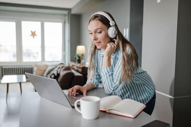 istock Woman works on a laptop at home and concentrates on work 1372203015