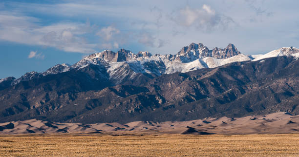 Photogenic Crestone Mountains above the Great Sand Dunes National Park and Preserve. stock photo