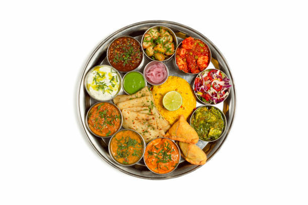 Typical south Indian Thali dishes served in a variety of traditional plates.