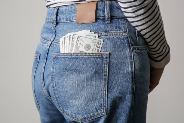 Free Stock Photo of Hundred Dollar Bill in Back Pocket of Jeans