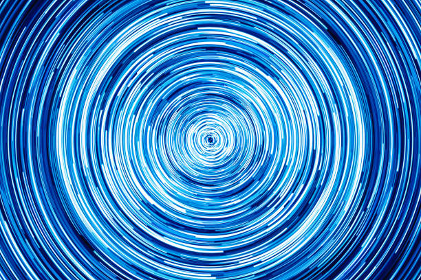 istock Neon circle lines with empty copy space inside isolated on black background. Colorful led lights long exposure rotation photo. Shiny light source. 1372205999