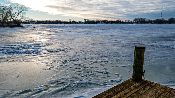 istock Winter lake sunset from pier 1372206686