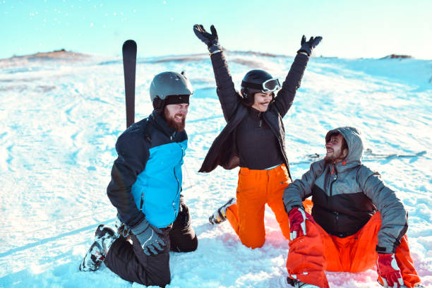 istock Happy Friends Enjoying Good Humor While Skiing On Mountain 1372214322