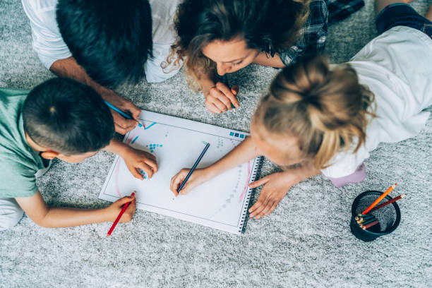 istock Family drawing on floor at home 1372217141