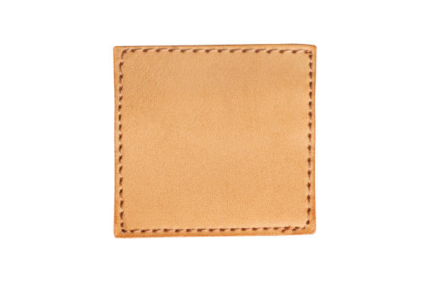 istock Brown stitched leather seam frame label tag isolated on white. 1372219230
