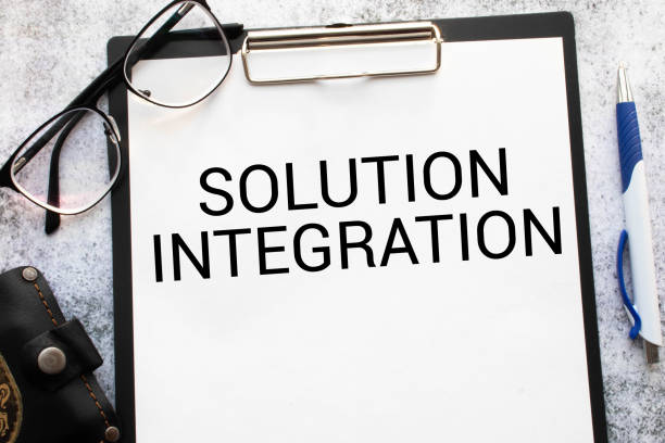 istock Closeup on businessman holding a card with SOLUTION INTEGRATION message, business concept. 1372222897