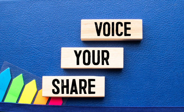 istock Share Your Voice text on a wooden cubes, 1372222900