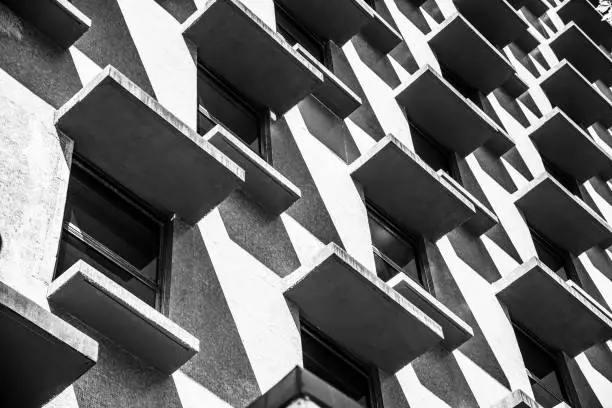 An abstract pattern of Brutalist architecture in black and white