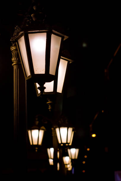 istock Close up of light poles during the night 1372223170