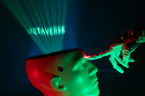 istock Humanoid robot hand touching cyborg shaped bust with text METAVERSE is written on brain, for machine learning 1372224479