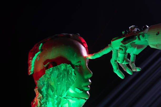 istock Humanoid robot hand touching cyborg shaped clay bust with forefinger 1372226799