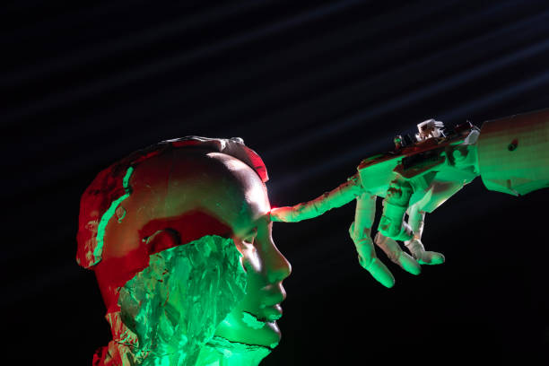 istock Humanoid robot hand touching cyborg shaped clay bust with forefinger 1372226864