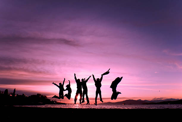 istock Group Jumping for Joy at Sunset 6180 137223974
