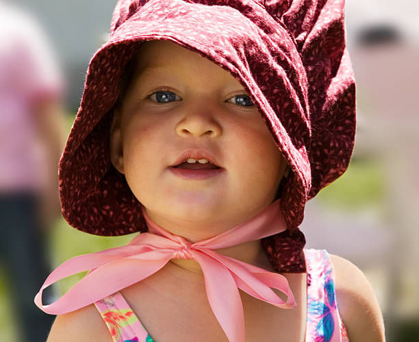 Portrait of little girl in 'pioneer' bonnet stock photo