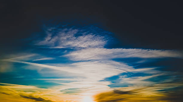 istock Vibrant beautiful winter sunset with angelic clouds 1372244633