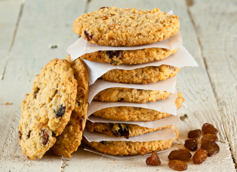Stack of oatmeal fruit cookies with sultanas and inter leaving