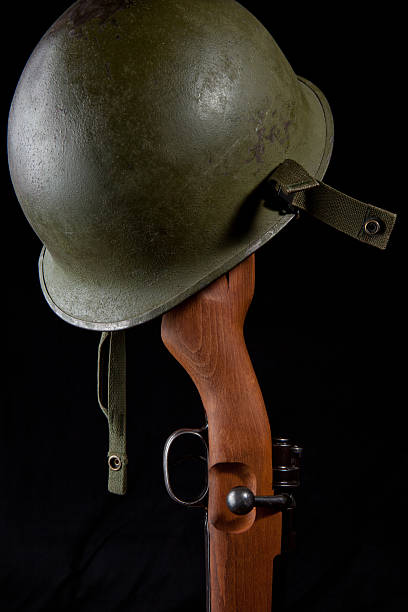 istock Helmet and Service Rifle 137225489