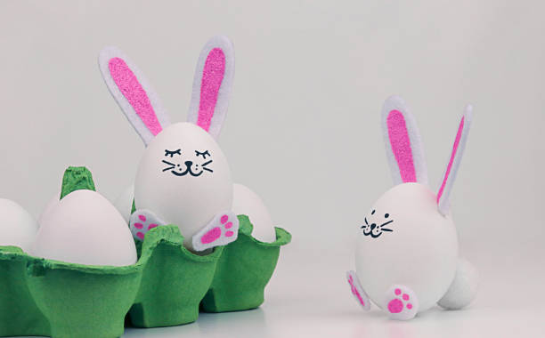 istock Easter eggs with bunny ears in a paper tray. 1372257147