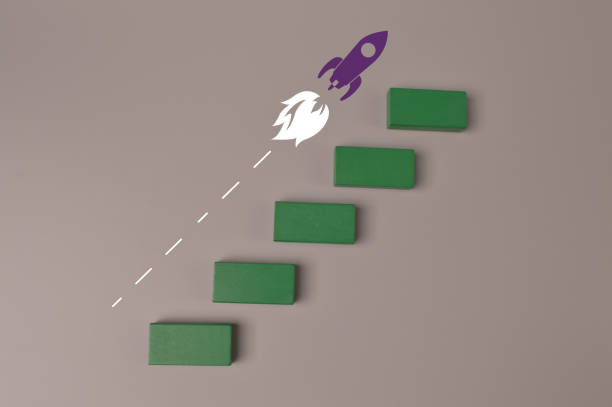 istock Wooden blocks with launching rocket. Business start up, new idea and new project concept. 1372257946