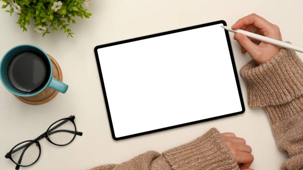 istock Female holding stylus pen and sketching something on digital tablet. 1372260663
