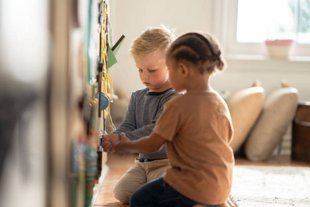 istock Little Boys at an Activity Board 1372261616