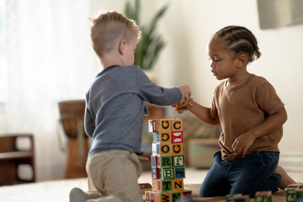 istock Little Boys Laying with Building Blocks 1372261617