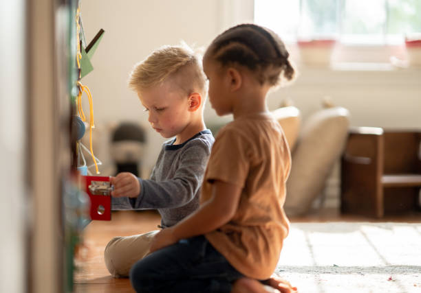 istock Little Boys at an Activity Board 1372261618