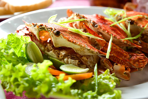 istock Three large red crabs with salad and lime 137226288