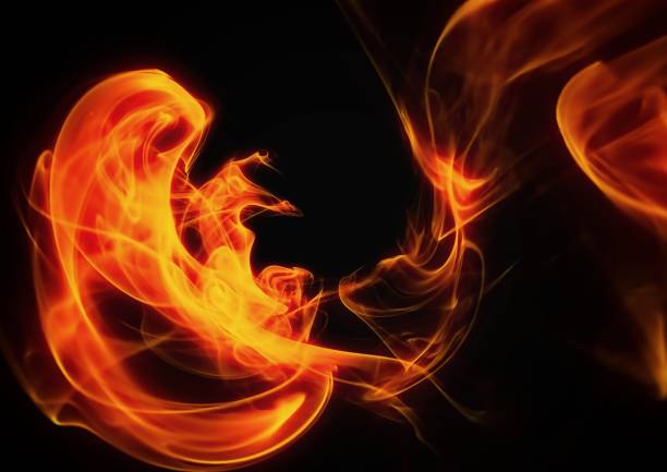 istock Illustration of fire swirling in the dark 1372271244