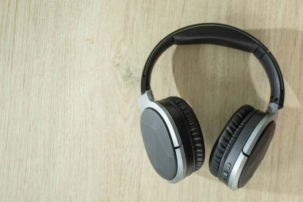 istock Bluetooth headphones placed on a wooden table 1372272315