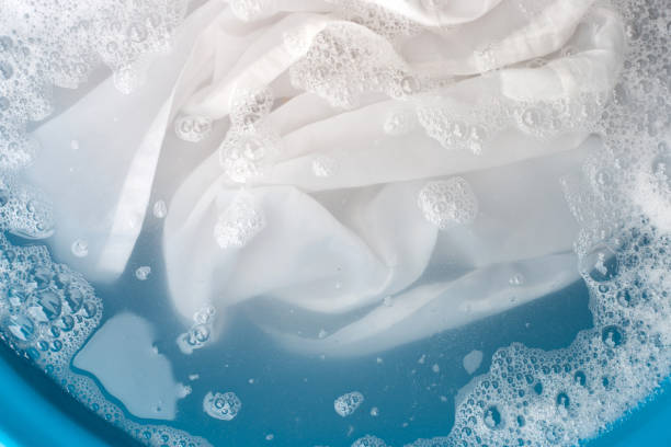 istock Soak a cloth before washing, white cloth 1372272480
