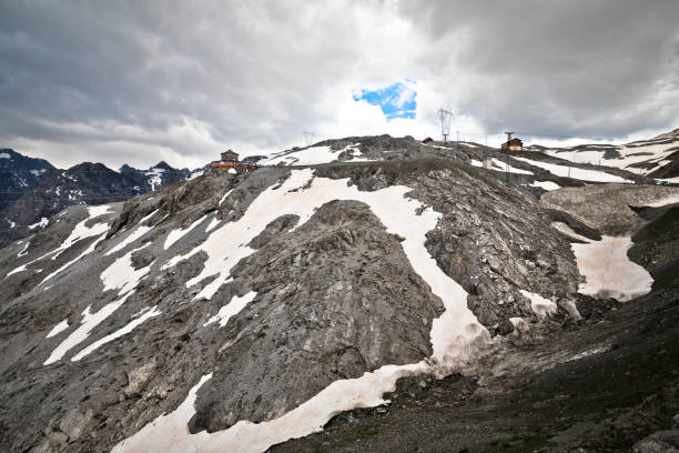 Stelvio mountain pass peak or Stilfser Joch scenic summer snow mountain view, border of Italy and Switzerland