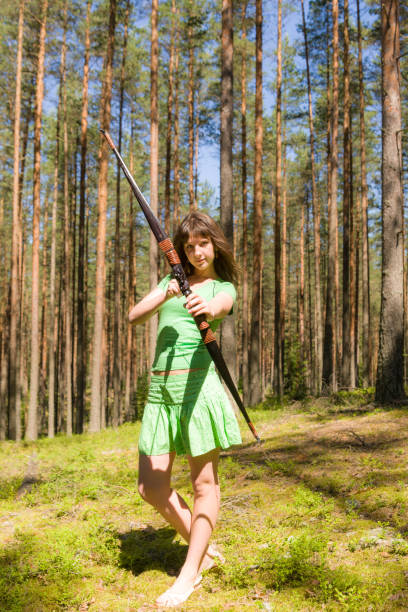 istock girl archer in the forest 1372275161